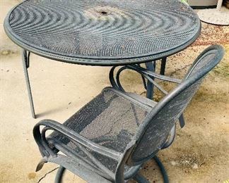 52_____$225 
Set - Metal round table 28x48 with 2 rocking chairs 37x22
  & 1 loungerone rusted 