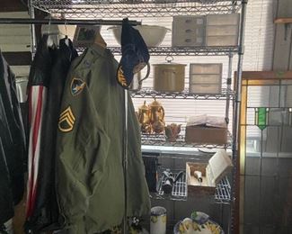 leather jackets, army jacket storage containers, brass tea set, candle sticks, pitcher, lamps
