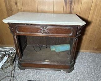 Lot 13   1 Bid(s)
Marble Topped Cabinet w/ Contents of Drawer