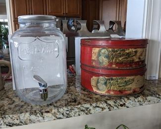 Water dispenser and vintage coffee tins