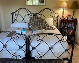 2 twin beds - bookshelf books lamps