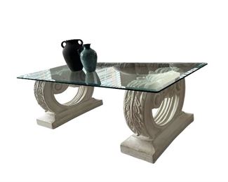 Glass coffee table with stone pedestals