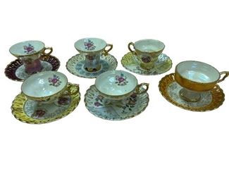 Iridescent tea cups and saucers