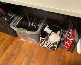 Records, CD’s  in bin - striped bag has toys