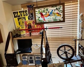 Amazing antique spinning wheel, Old Elvis concert poster, a laptop. Stained glass birds, very vintage Barbie with case full of clothes… some cool vintage purses, 3 carved Asian guys, a katana sword, a Captain Kirk “action figure” (it’s a doll!) from Star Trek 
