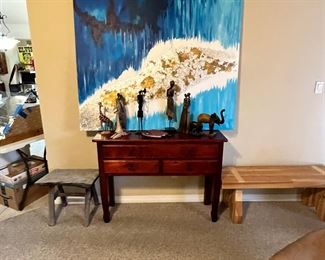 Beautiful large painting, multicultural collection of statues in carvings, and to really fantastic wooden benches