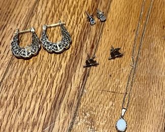 Top left are marked Turkey, heavy and made well… maybe gold plated silver, not sure. Top right is 14k white gold set Diamond studs. Bottom left… 14k enameled bird earrings…bottom right is a 14k gold necklace with a beautiful Opal!