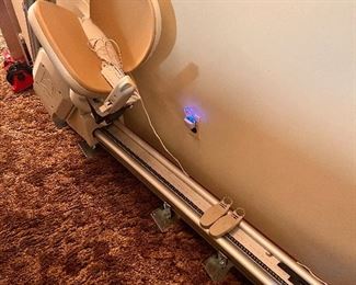 5' long acorn chair lift! (there are four of them as this is a tri level home... these could be used in a home with a landing as well!