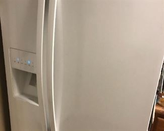 Refrigerator - $275.00   -  Whirlpool Side by side with 3 shelves and 1 pull out bin in freezer side, and  2 shelves and 3 pull out bins in refrigeration side.     33”W x65”H x33”D