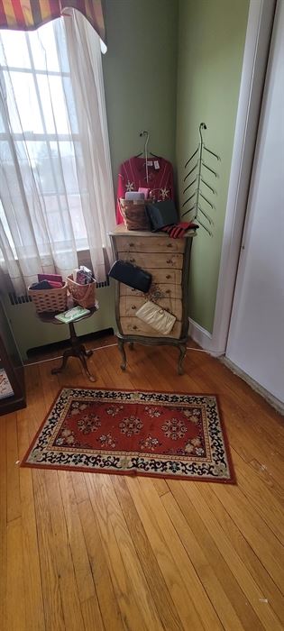 Purses, jewelry console, cute round table, rug