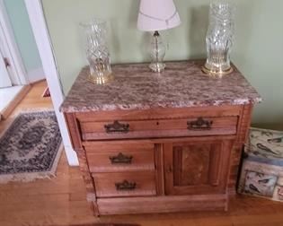 Eastlake side table with marble top.  Waterford candle lamps