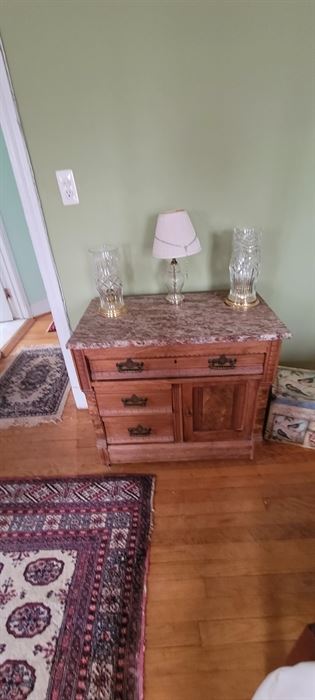 Eastlake side table with marble top.  Waterford candle lamps