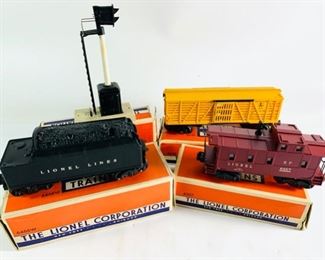 Four Vintage Lionel Corp Electric Model Train Cars/Electric Block Signal With Original Boxes - Includes Caboose, Whistle Tender, Stock Car, and Automatic Block Signal, All in Great Condition, Not Tested - Lot 826