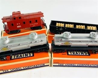 Four Vintage Lionel Corp Electric Model Train Cars With Original Boxes - Includes Caboose, Two Tank Cars, and A Gondola Car, 