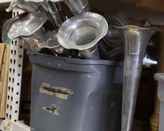 many silver colored tall vases