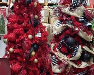 Many pre-decorated Christmas trees, sold as-is