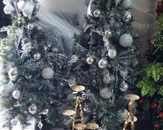 Many pre-decorated Christmas trees, sold as-is