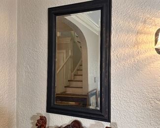 Beveled mirror with bronze finished plastic frame