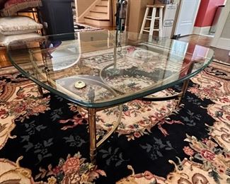 Glass and brass cocktail table