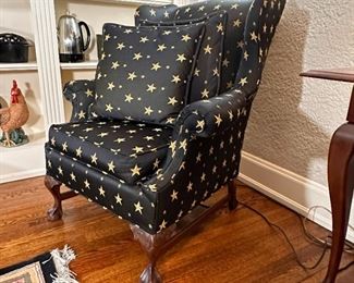 Custom star upholstered wing back chair with ball and claw foot