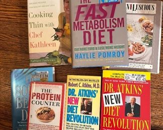 Group of books including Adkins and Fast Metabolism Diet