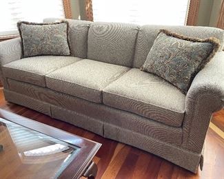 Tan sofa w/ 2 pillows. 80"W x 35"D x 31"H,  $345