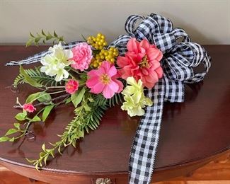Floral arrangement with black/white checked ribbon,  14" W,  $14