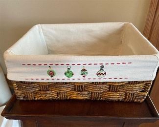Woven wicker basket w/ Xmas liner,  Approx 11"W x 9"D, $7