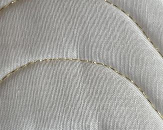 Additional view of gold thread on white place mats
