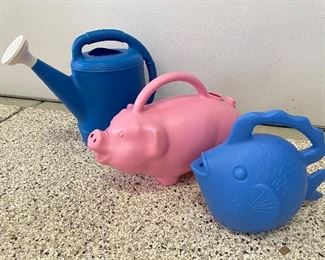 Blue watering can, was $5, NOW $3.  Pig watering can, was $8, NOW $5.  Blue fish watering can, was $7, NOW $4