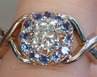 14K white and rose gold 0.96ct diamond tanzanite ring - A custom 14k white and rose gold overlapping size 7 twist hand style ring set with one 0.96ct, SI2 clarity, J color,  diamond surrounded by  twelve .02ct lilac blue tanzanite stones. Comes with GIA diamond grading COA. 