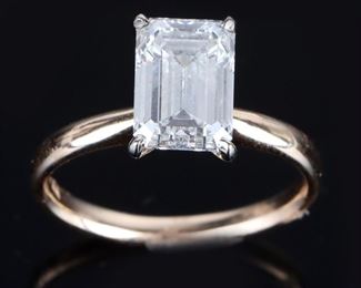 14k yellow gold diamond ladies ring with one GCAL certified 2.58ct emerald cut diamond VS2 in clarity and I in color. Comes with certification papers and Helzberg receipts. 