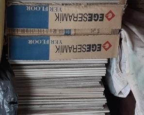 Large size tiles as well as small ones.  Beige/white colors. 