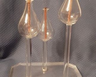 Candles on plexiglass stand. 