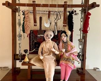 Antique Folk art depicting weavers sitting in front of a loom with partially finished Rug.  Very Cool and Unique.