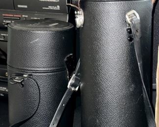 Pair of Camera Lenses and Cases: Tamron 80-200mm Zoom and the other is a Nikon 50 mm Lens.