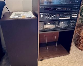 This is a vintage Panasonic Stereo with Turntable, Pre-Amplifier, Dual Cassette Player and Pair of Speakers with Record Storage. Very Retro.