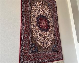 An absolutely stunning Vintage Isfahan Persian rug hanging on the wall.  It doesn’t get any nicer!  Signed in Arabic on  the fringe edge.