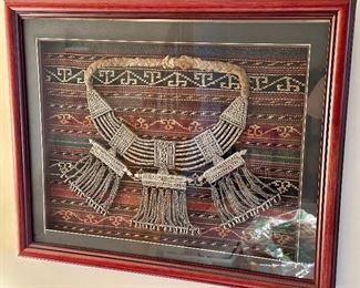 This is a Sterling Silver and beaded antique  necklace, that sits atop an exquisite Persian Rug, all beautifully framed.  This necklace was a show of wealth in days of yore.  It really  is  a spectacular piece!