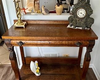 Check out this spectacular table.  The  lion heads and clawed feet make this antique a real collector’s ptece  and conversation table!  Perfect for a hall/Entry, Buffet or even Antique Bar.