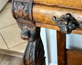 Check out this spectacular table.  The  lion heads and clawed feet make this antique a real collector’s ptece  and conversation table!  Perfect for a hall/Entry, Buffet or even Antique Bar.