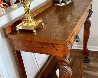 Check out this spectacular table.  The  lion heads and clawed feet make this antique a real collector’s ptece  and conversation table!  Perfect for a hall/Entry, Buffet or even Antique Bar.