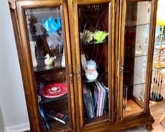 3 Door Display Cabinet with Glass Shelves in Excellent Condition.