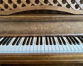 Piano by Kawai - btw the top comes off to give it the same rich sound as a baby grand, but without hogging all the space!  Made in Japan, Circa 1980's Model 202-M