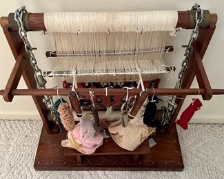 Antique Folk art depicting weavers sitting in front of a loom with partially finished Rug.  Very Cool and Unique.