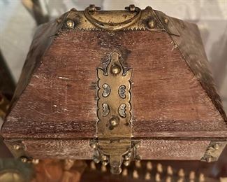 This is a special antique box with brass hardware.