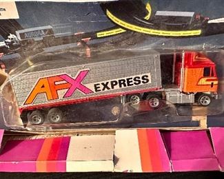AFX Express Tractor Trailer "GMC Astro 95 with AFX Trailer still in Blister Pack.