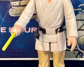 Original 1977 Figures including Left to Right: Darth Vader, R2D2, Luke Skywalker, Princess Leia and Obi-Wan