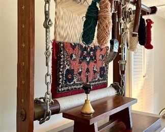 Antique Folk art depicting weavers sitting in front of a loom with partially finished Rug.  Very Cool and Unique.