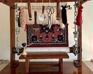 Antique Folk art depicting weavers sitting in front of a loom with partially finished Rug.  Very Cool and Unique.